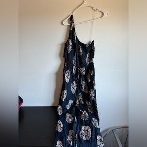 One sleeve floral navy blue and tan romper. Size small. Long pants with a tie